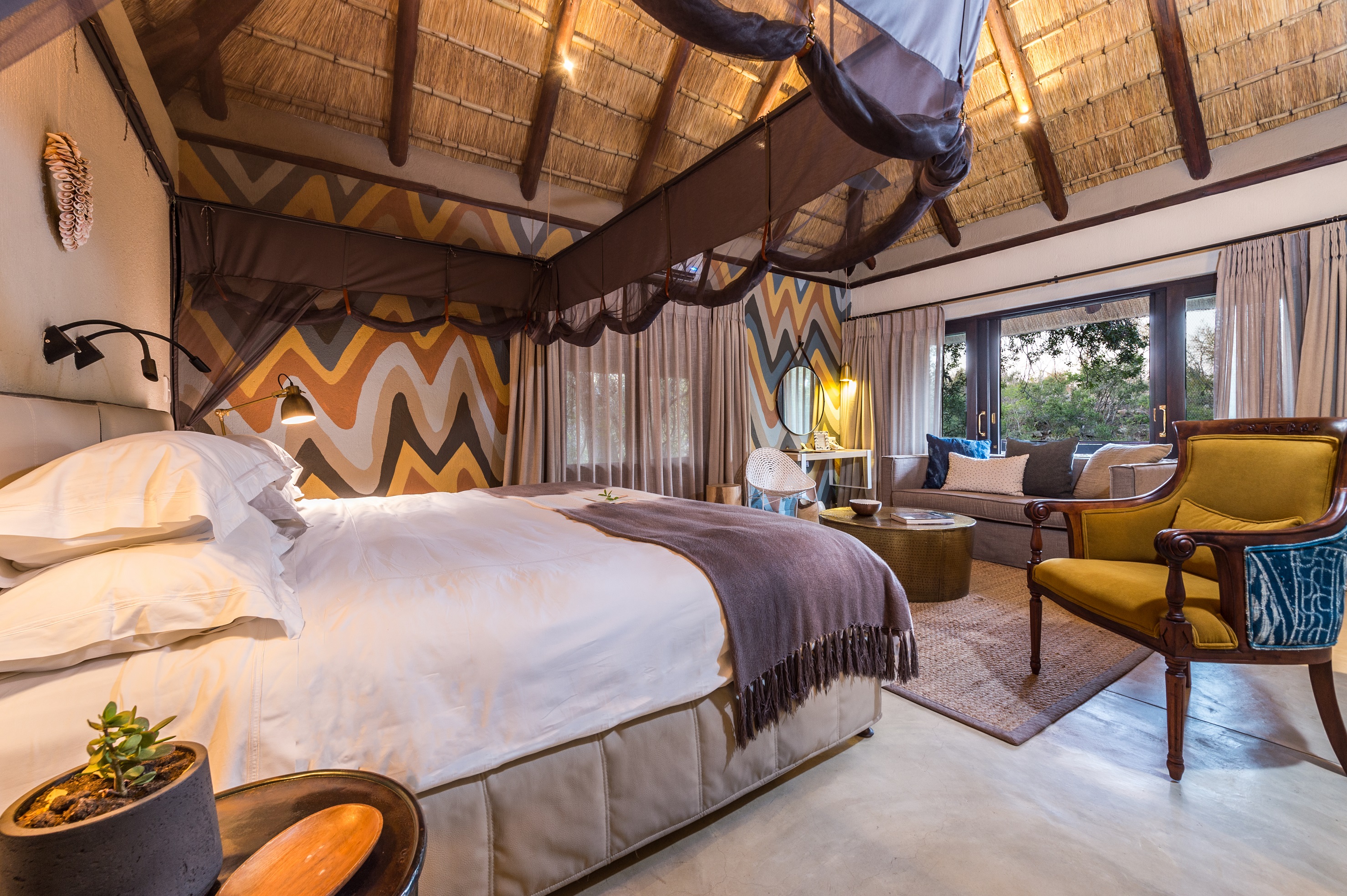 <p>The lodge features just six suites, each of which is decorated in a beautiful African-inspired style and features a private deck or veranda with views of the surrounding bushveld. The rooms are spacious and airy, with high thatched ceilings, natural materials such as wood and stone, and earthy tones that create a warm and inviting atmosphere.</p>